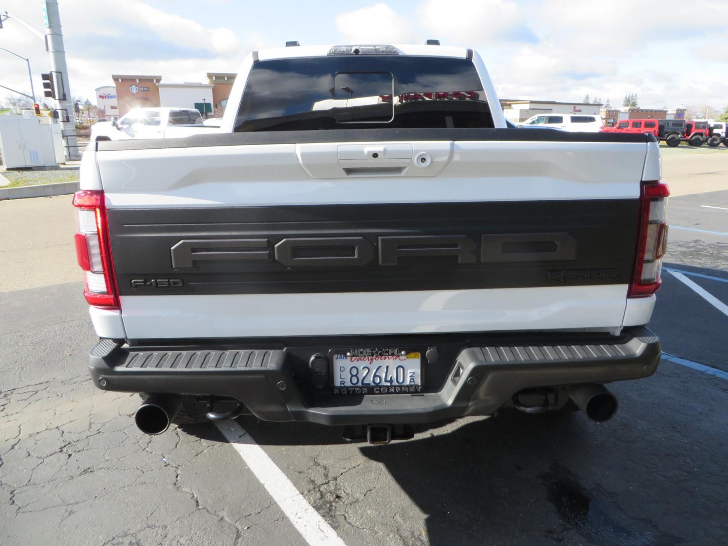 2023 White /BLACK Ford F-150 Raptor SuperCrew 4WD (1FTFW1RG6PF) with an 3.5 V6 engine, 6A transmission, located at 2630 Grass Valley Highway, Auburn, CA, 95603, (530) 508-5100, 38.937893, -121.095482 - Raptor sitting on Eibach front and rear springs, 37" Nitto Ridge Grappler tires, 17" Method NV wheels, and window tint. - Photo#5